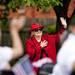 Ann Arbor resident Nancy Luomala waves to the parade as vehicles pass on Monday, May 27. Daniel Brenner I AnnArbor.com